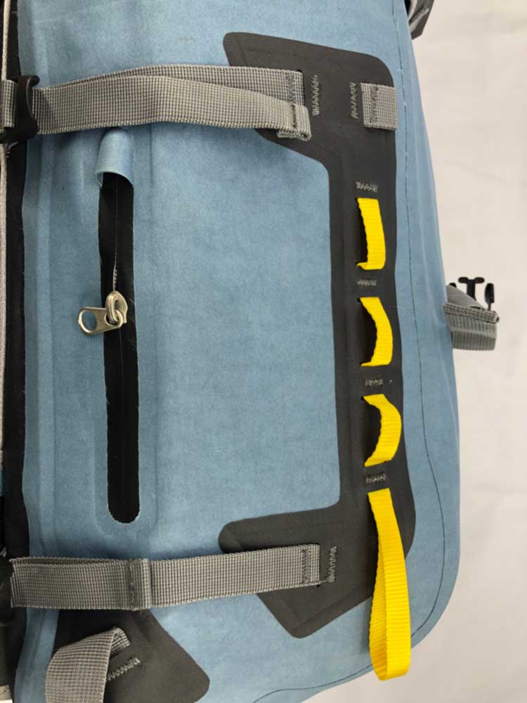 daisy chain lash points and welded waterproof zip pocket on backpack